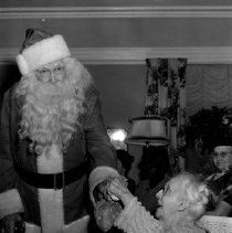 Santa Claus Presents Gifts to Mrs. Nancy Kelliher at Sammond Pleasant Lodge